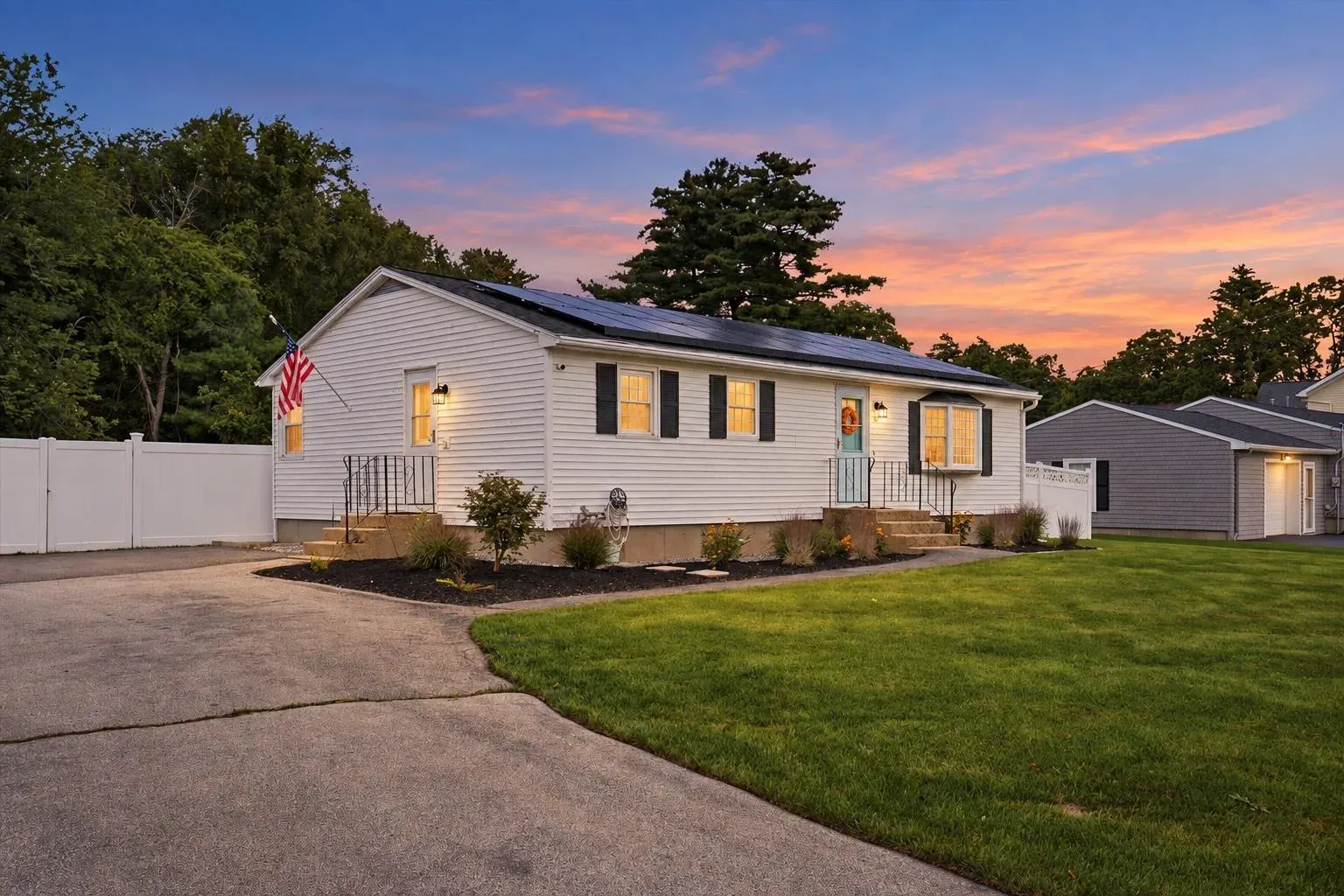Driveway and front exterior at dusk at 14 Bloomingdale Drive