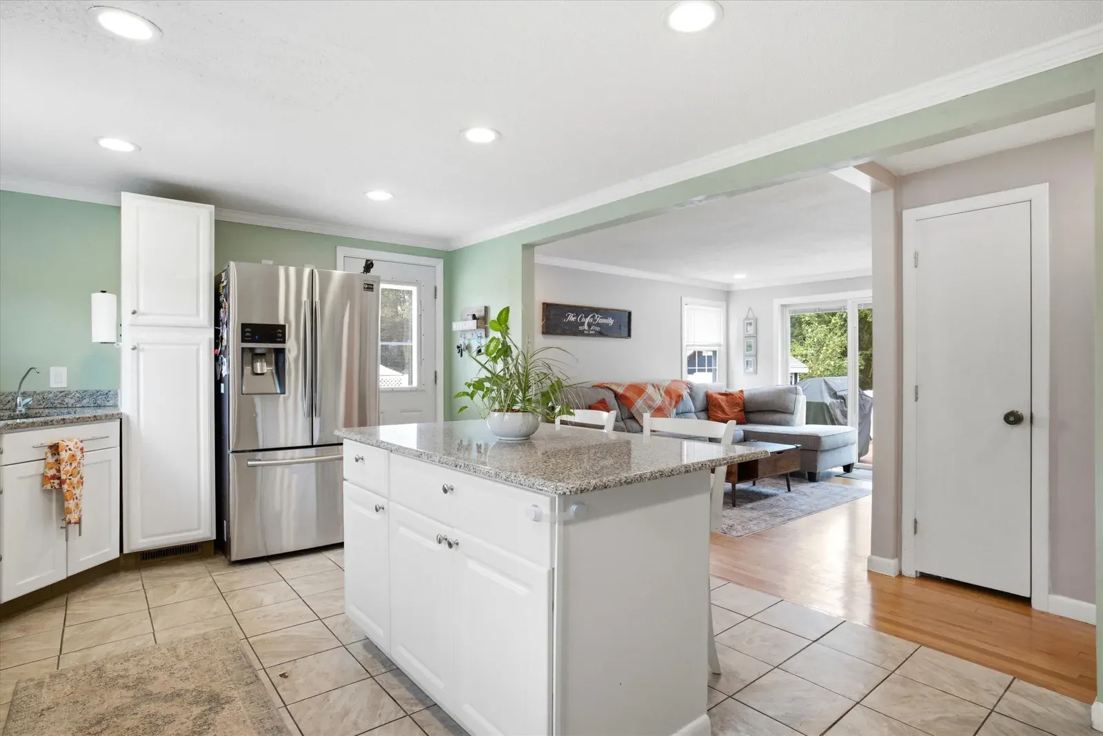 Kitchen island and refrigerator at 14 Bloomingdale Drive