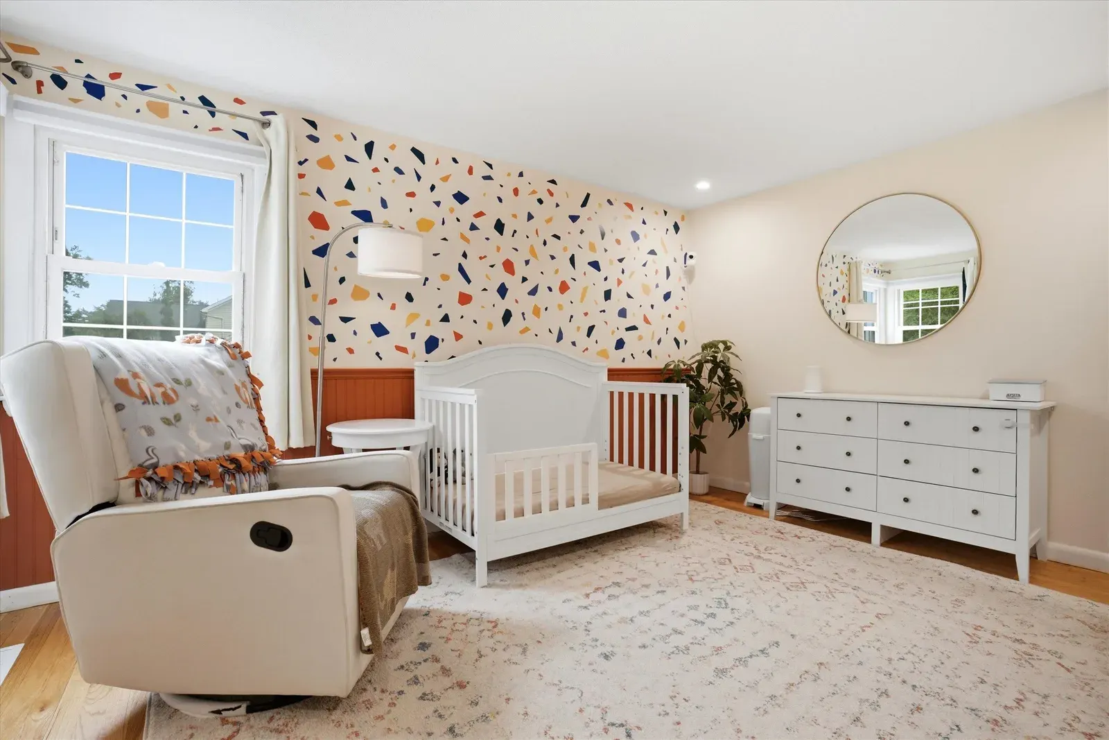 Bedroom with crib and dresser at 14 Bloomingdale Drive