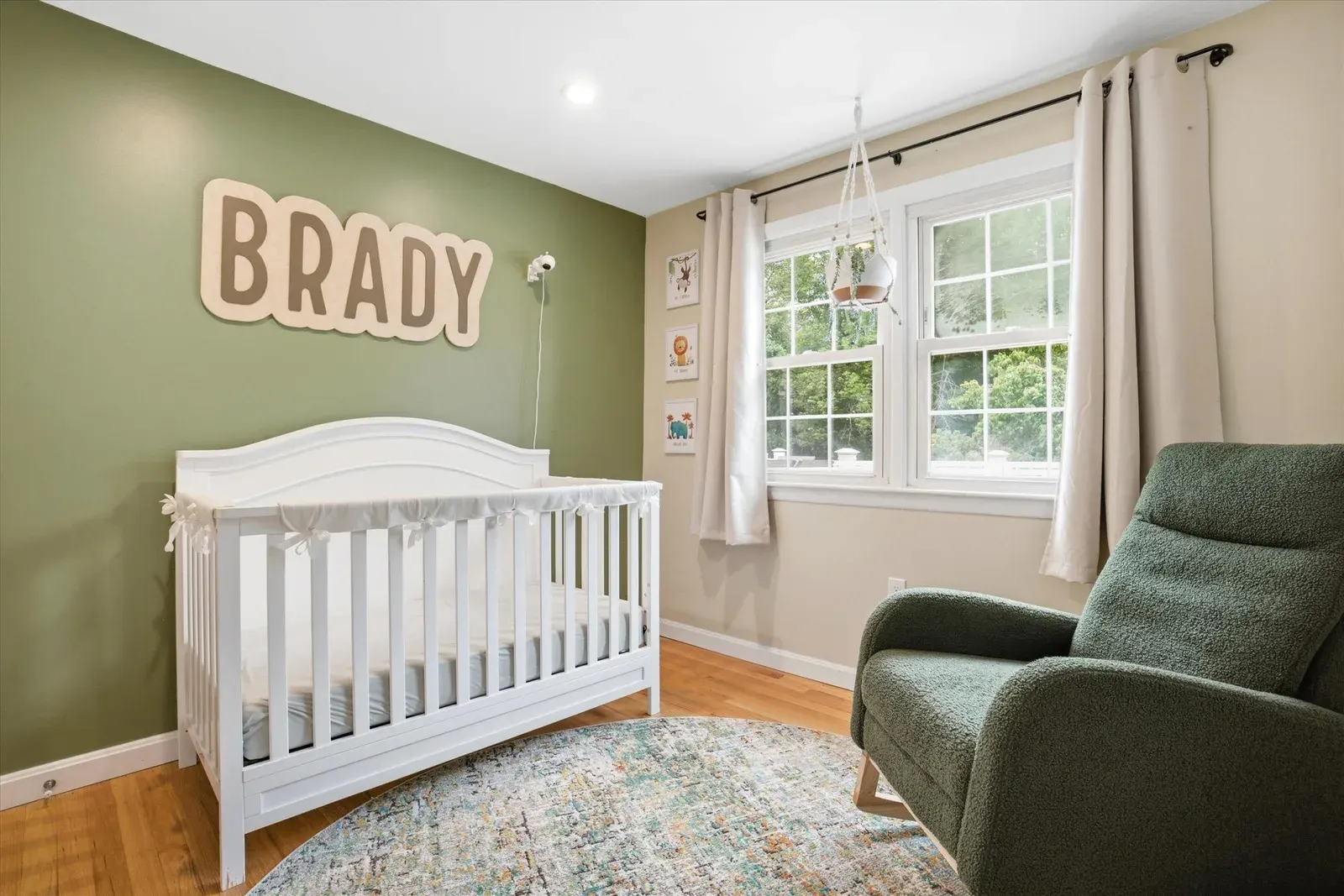 Bedroom with crib and accent wall at 14 Bloomingdale Drive
