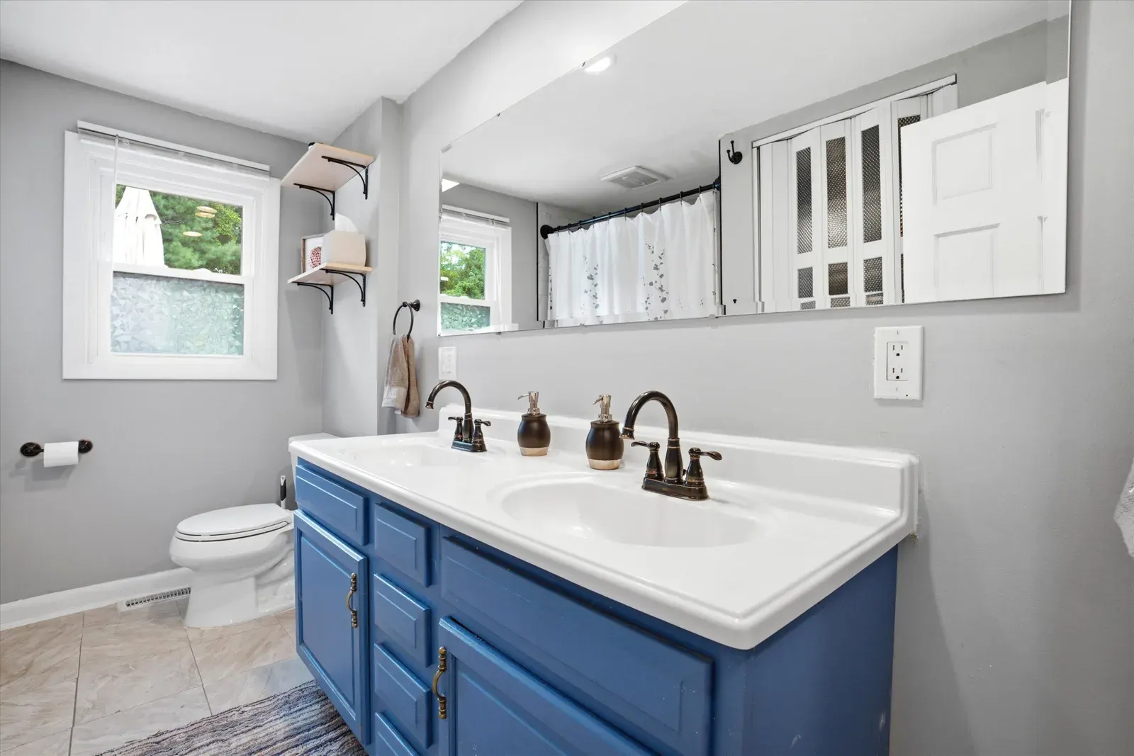 Bathroom with double vanity at 14 Bloomingdale Drive