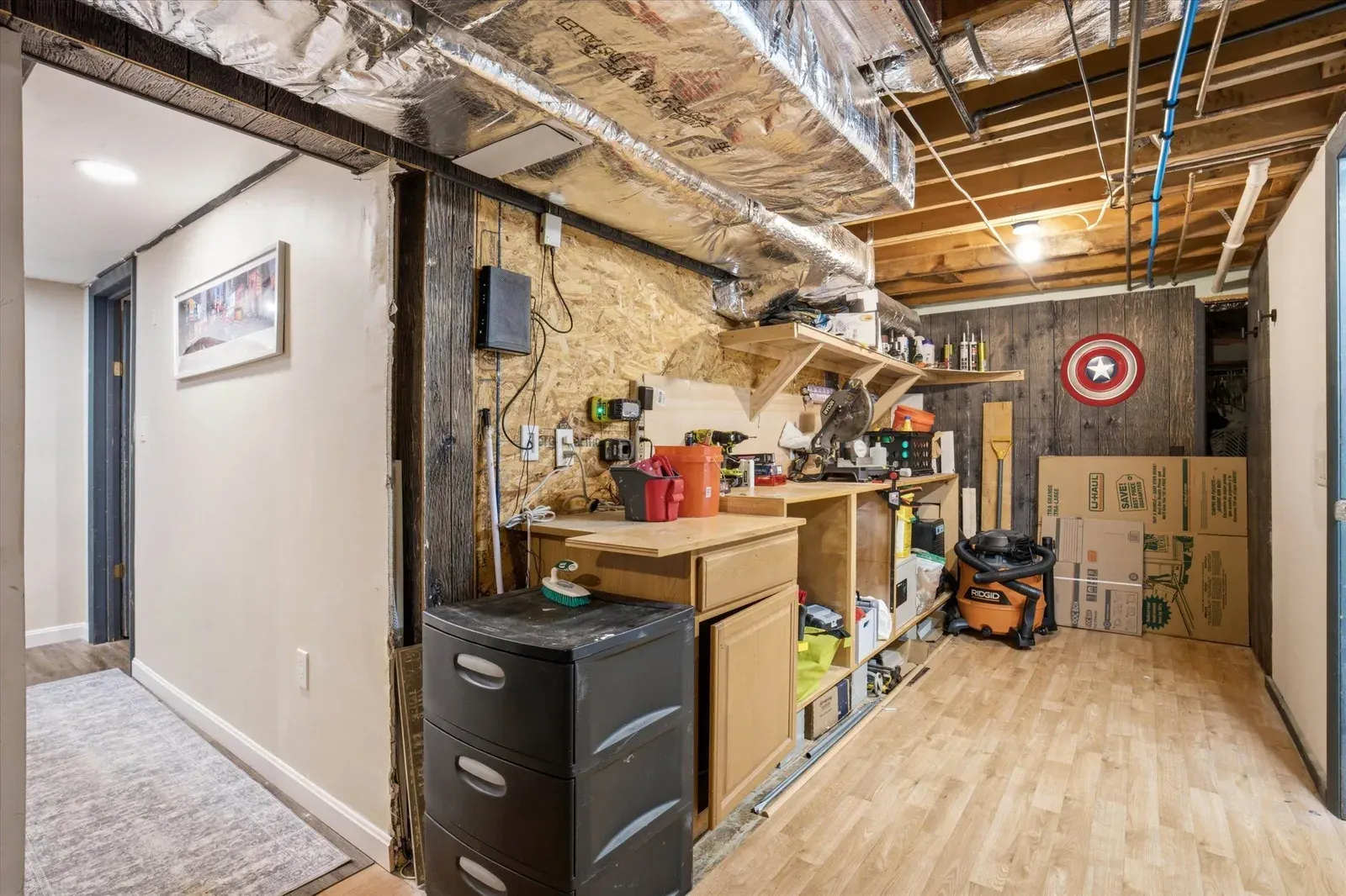 Basement workbench and storage at 14 Bloomingdale Drive