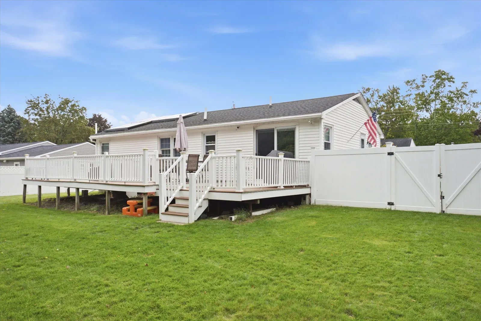 Rear exterior and raised deck at 14 Bloomingdale Drive