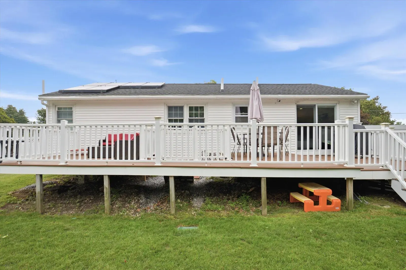 Raised deck across the rear of the home at 14 Bloomingdale Drive
