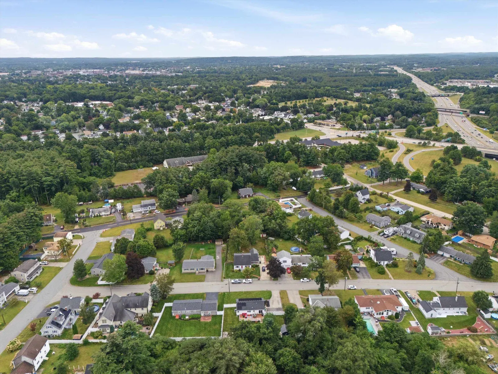 Aerial view of the surrounding neighborhood at 14 Bloomingdale Drive