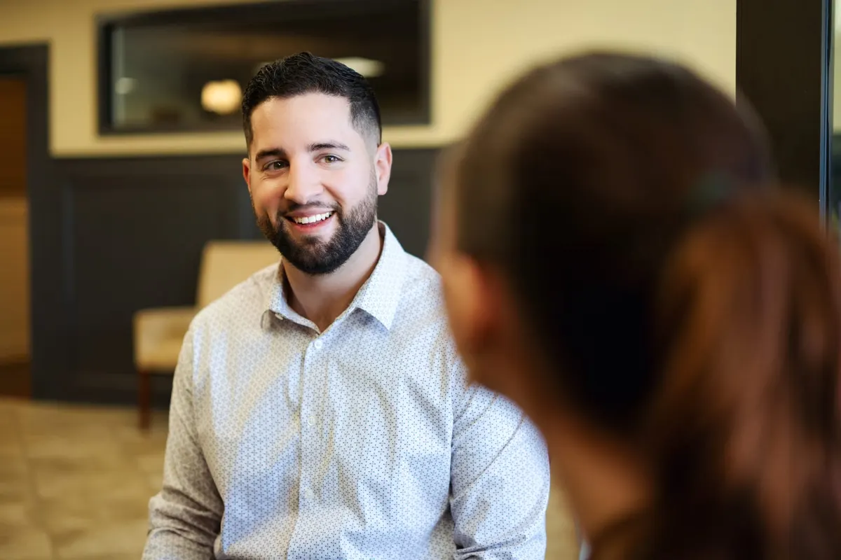 Tyler Costa meeting with a client about a New Hampshire move