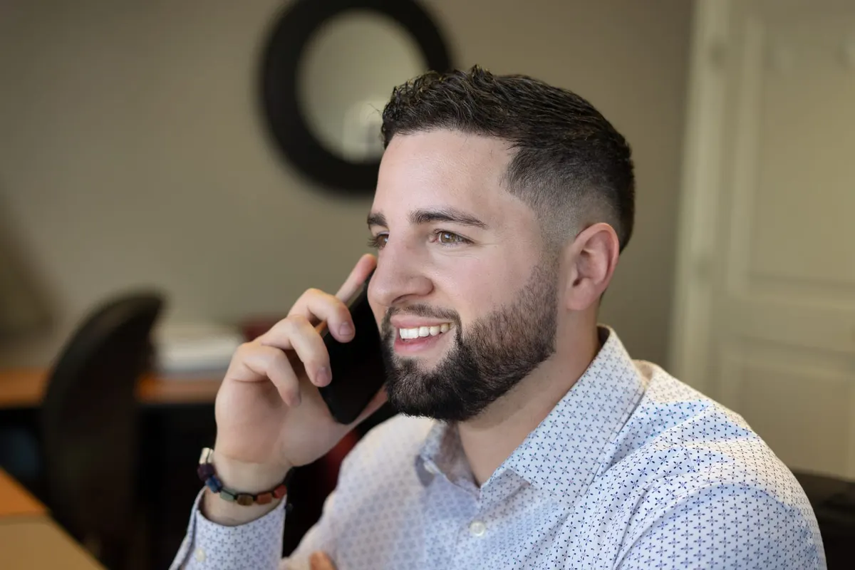 Tyler Costa discussing a Southern New Hampshire real estate move by phone