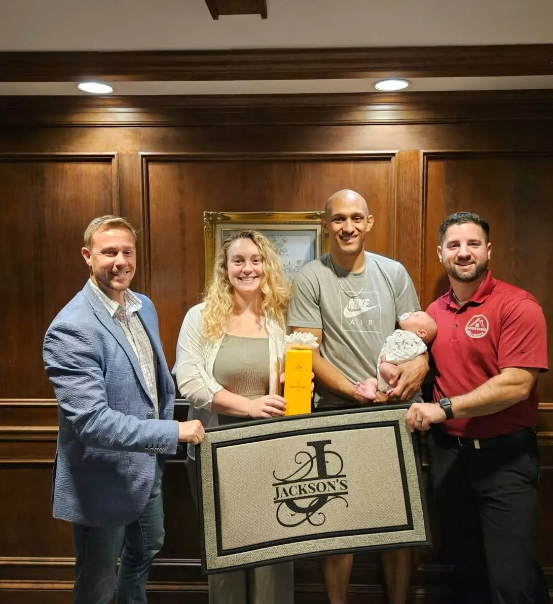 Tyler Costa and home buyers celebrating a successful closing