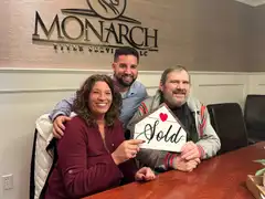 Tyler Costa and clients celebrating a completed home sale