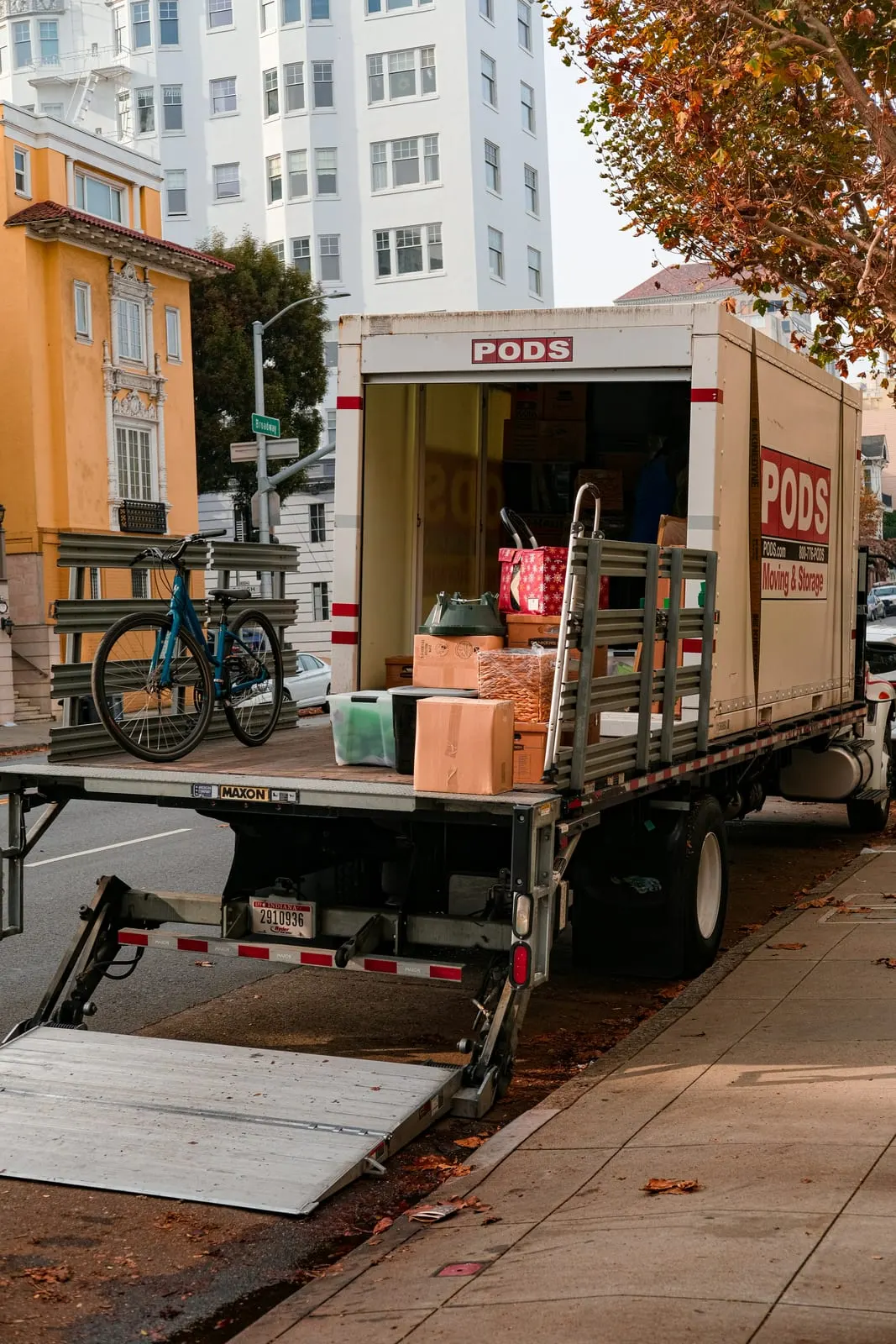Moving truck parked on a city street during a relocation